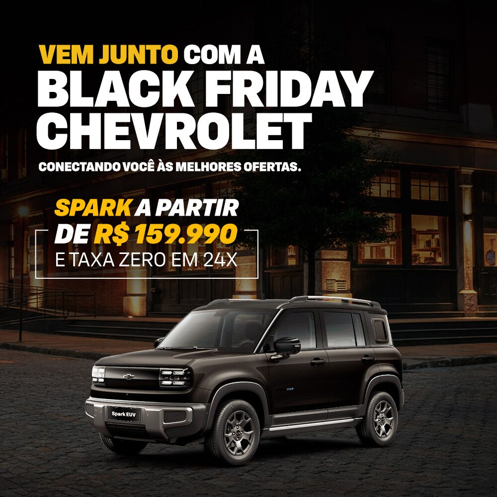 Uma Spark estacionada em uma rua da cidade à noite. A imagem promove a campanha de Black Friday da Chevrolet.