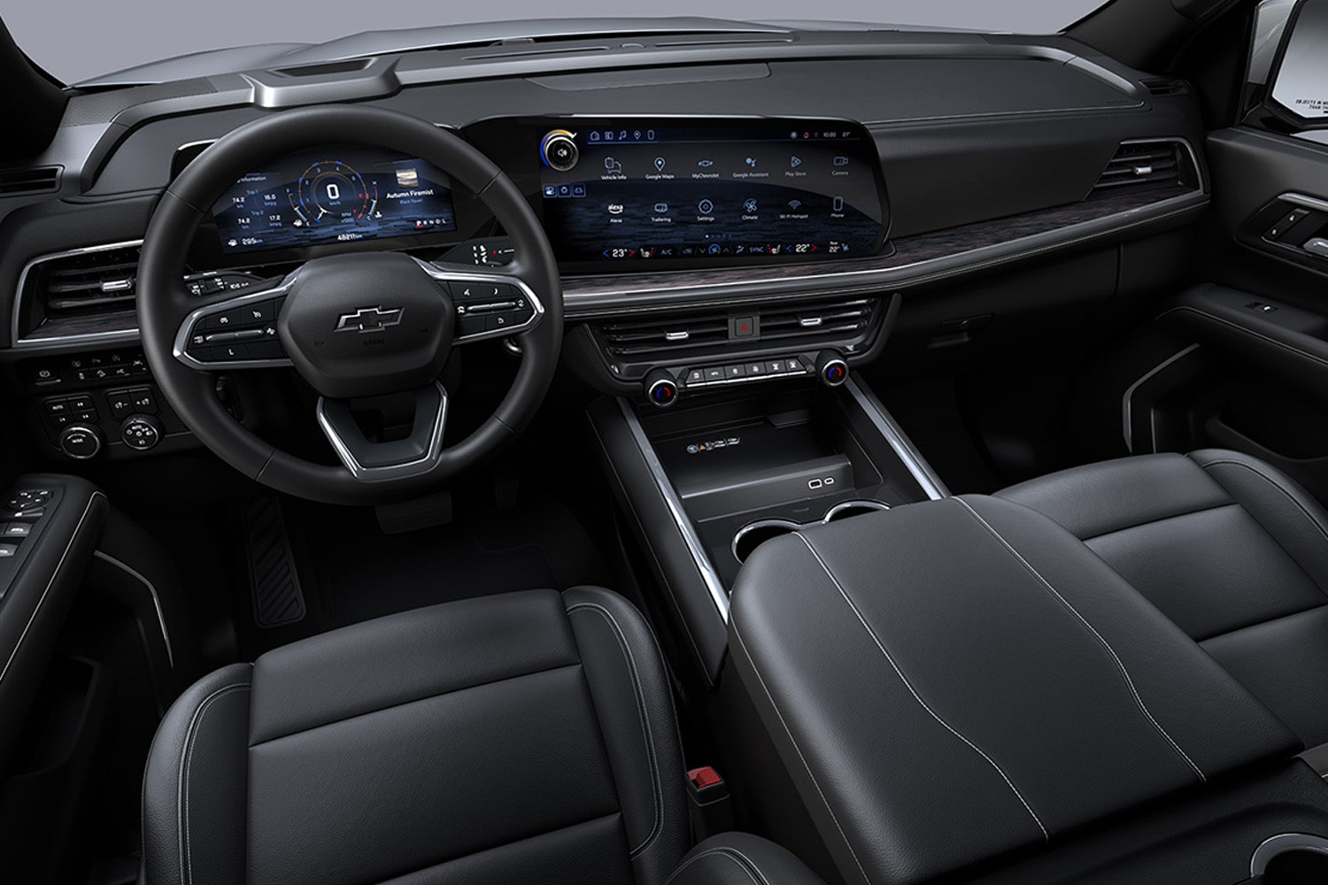 Vista interior de la Chevrolet Tahoe desde la perspectiva de un pasajero en uno de los asientos traseros, destacando las patallas táctiles en la segunda fila de asientos.